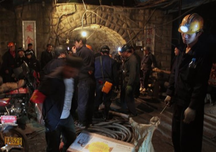 In this Sunday, Nov. 21, 2010 photo, rescuers get ready to enter the flooded Batian Coal Mine in Xiaohe town of Weiyuan county in southwest China's Sichuan province. Rescuers were racing Monday to reach 28 people trapped while doing safety work in coal mine in southern China, the latest accident in the world's deadliest mines.  (AP Photo/Color China Photo) CHINA OUT